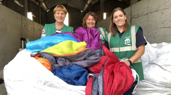 PATH volunteers collect discarded sleeping bags. Picture from Raidió Teilifís Éireann